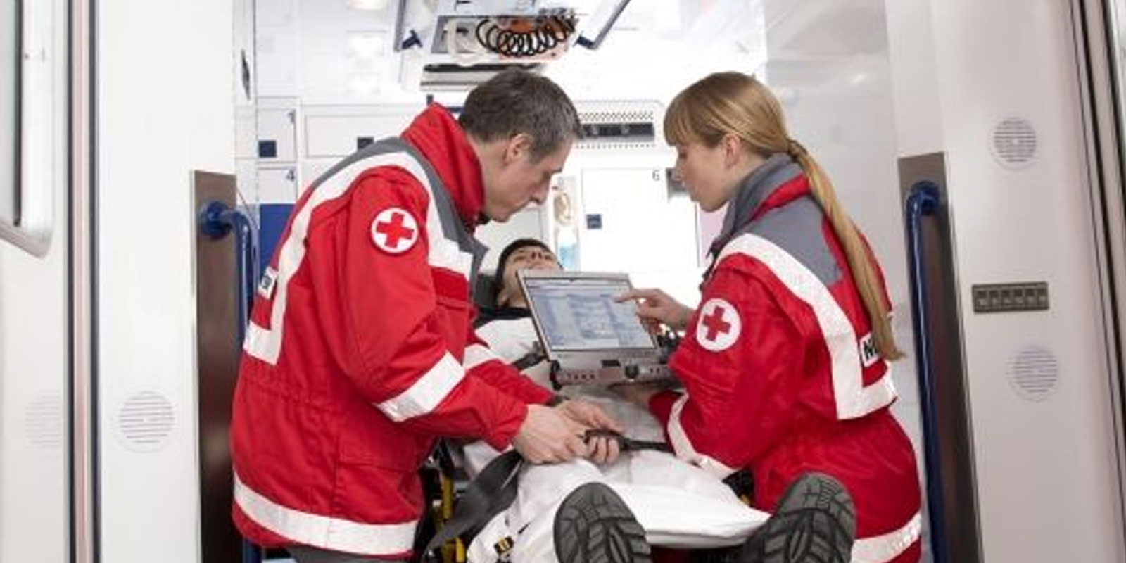 doctors chhecking laptops