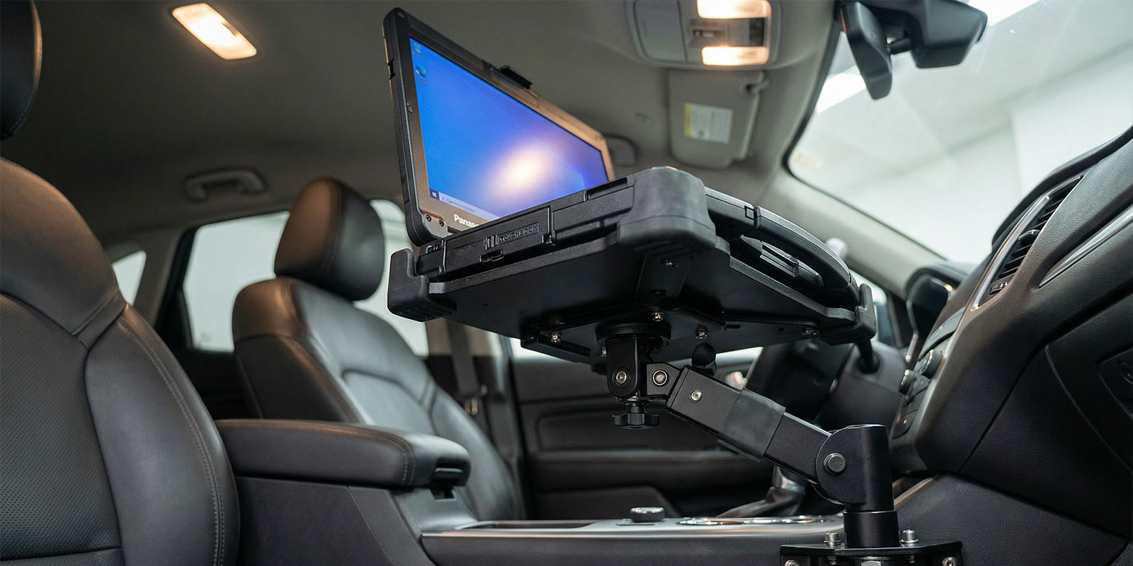 laptop in stand in car